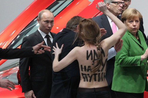Russian-President-Vladimir-Putin-is-attacked-by-an-activist-of-the-Ukrainian-women-rights-group-Femen-as-German-1818513.png.jpg