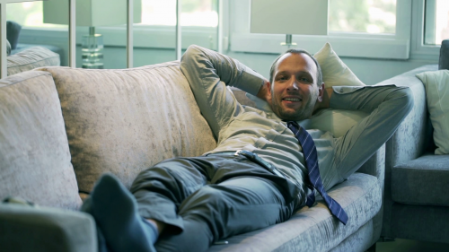 happy-businessman-lying-on-comfortable-couch-and-smiling-to-the-camera_eyccjc24_thumbnail-1080_01-2021180718.png
